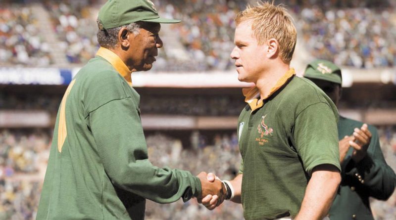 Morgan Freeman shakes hands with Matt Damon on the rugby pitch in Clint Eastwood's Invictus.