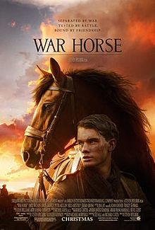 War Horse movie poster with Jeremy Irvine and the horse behind him with a sunset