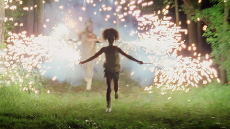 Quvenzhané Wallis running with fireworks in Beasts of the Southern Wild
