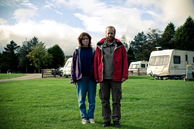 Alice Lowe and Steve Oram standing at a campground in the movie Sightseers