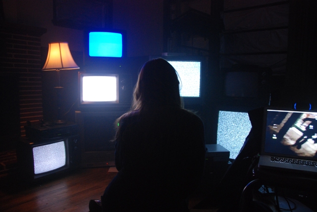 Woman at TV screens in VHS 2