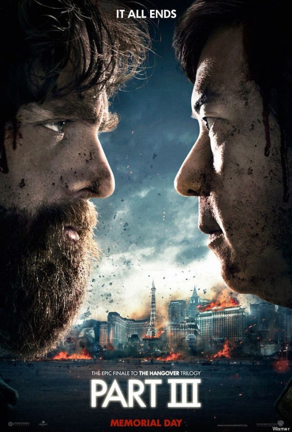 Hangover 3 poster with Zach Galifianakis and Ken Jeong face to face with the city burning in the background
