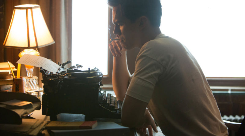 Nicholas Hoult frantically writing away as J.D. Salinger in REBEL IN THE RYE.