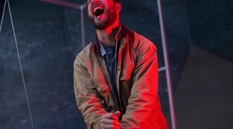 Logan Marshall-Green cries out in pain from stabbing his own hand in the sci-fi movie Upgrade.