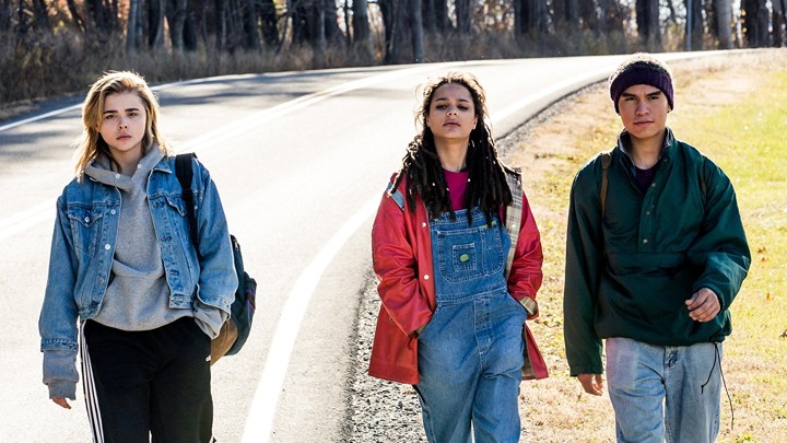 Chloe Grace Moretz, Sasha Lane, and Forrest Goodluck walk down a lonely road in The Miseducation of Cameron Post