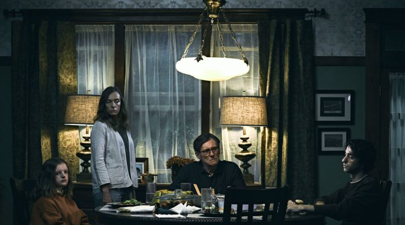 Toni Collette and Gabriel Byrne preside over family dinner in Hereditary.