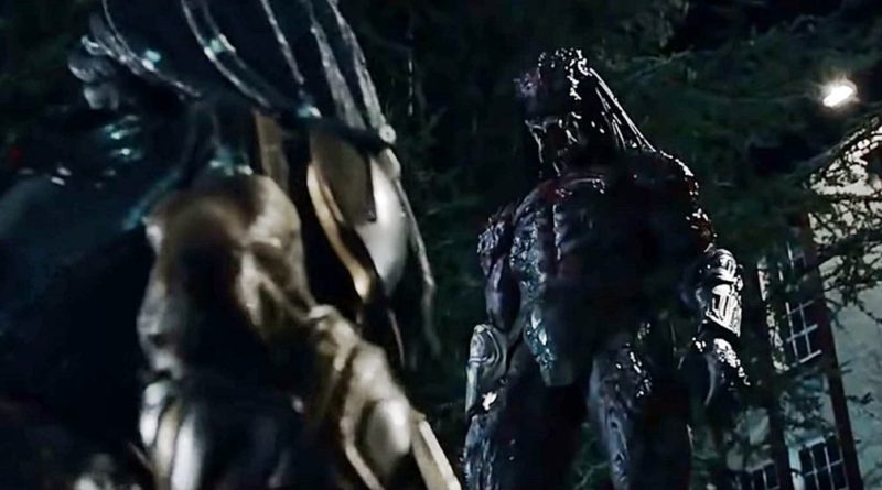 A taller stronger Predator in the movie The Predator stands over another one in the foreground.
