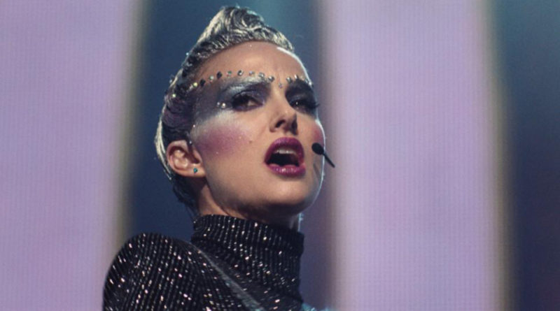 Natalie Portman singing in futuristic makeup in the film Vox Lux