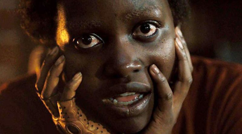 Lupita Nyong'o stars creepily with her head in her hands in the movie US