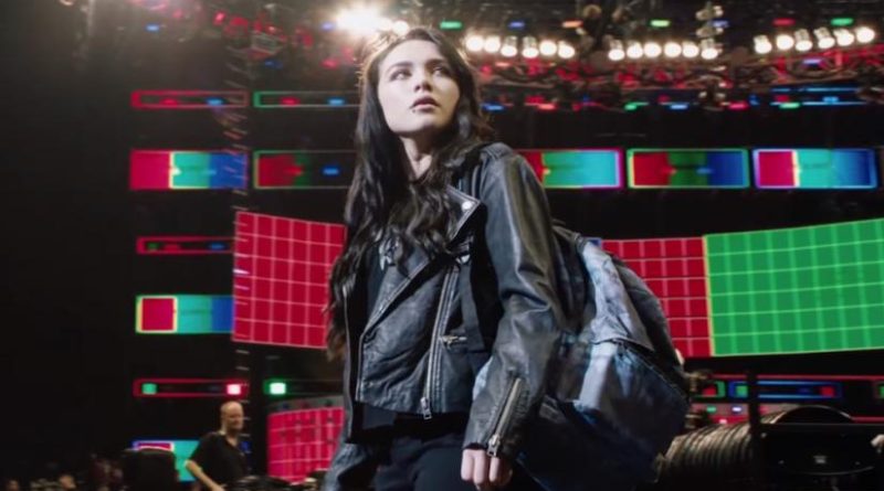 Florence Pugh looks up to see the lights of a stadium in the movie Fighting with My Family