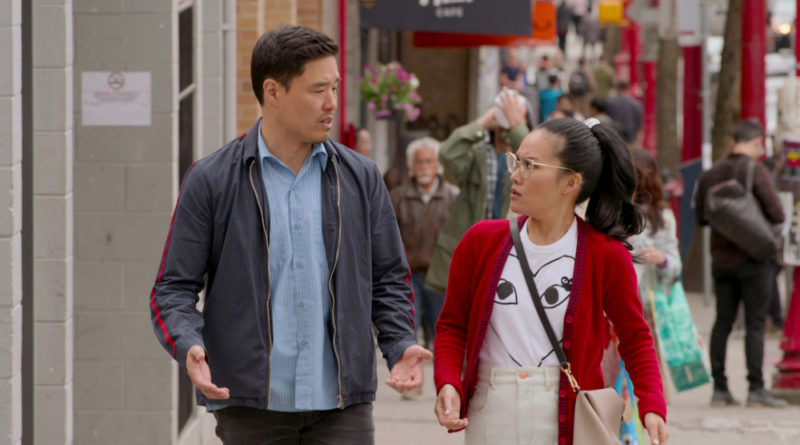 Randall Park talks to Ali Wong while they walk along in the movie Always Be My Maybe