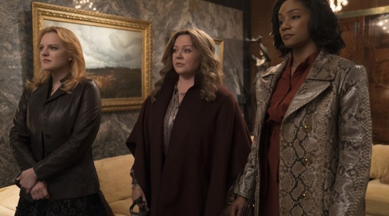 Elisabeth Moss, Melissa McCarthy, and Tiffany Haddish stand defiantly in the movie The Kitchen
