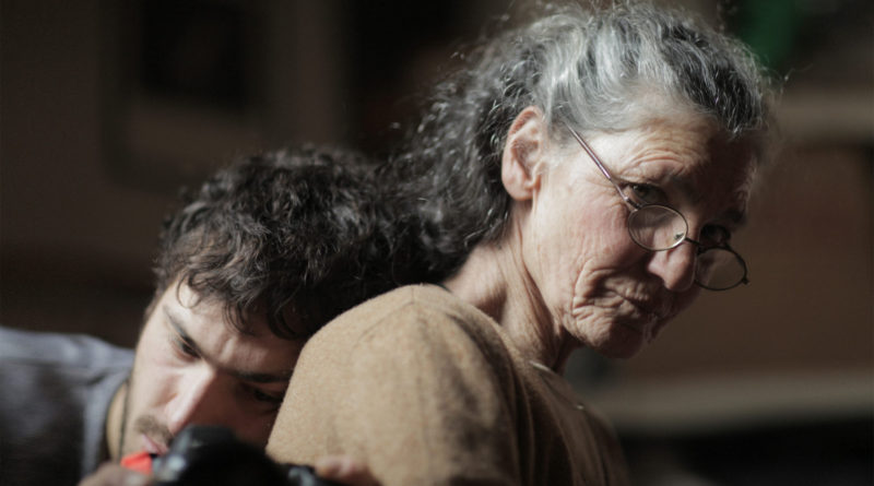 Beniamino Barrese leands his head on his mother Benedetta Barzini's back in the documentary The Disappearance of My Mother
