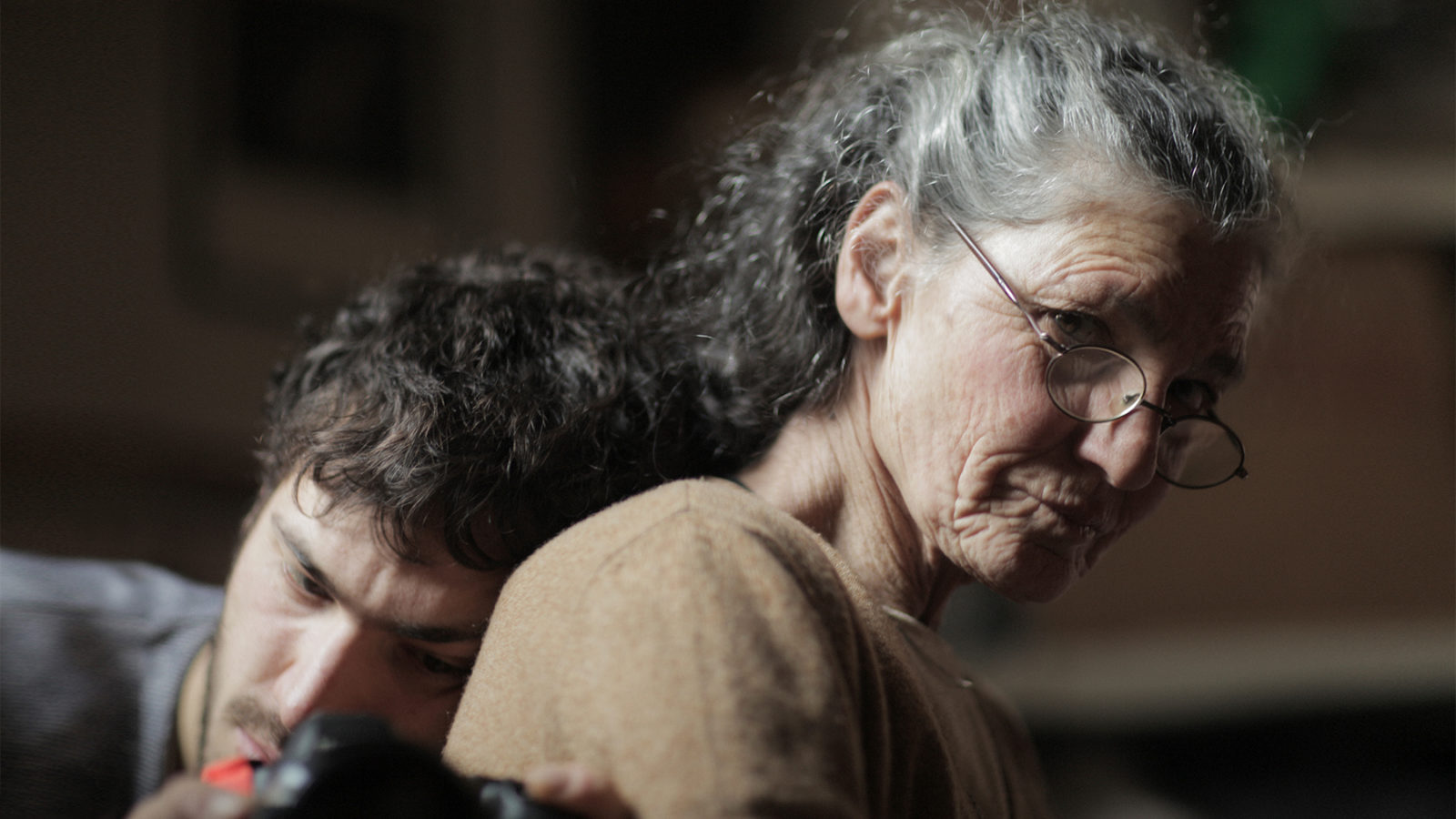 Beniamino Barrese leands his head on his mother Benedetta Barzini's back in the documentary The Disappearance of My Mother