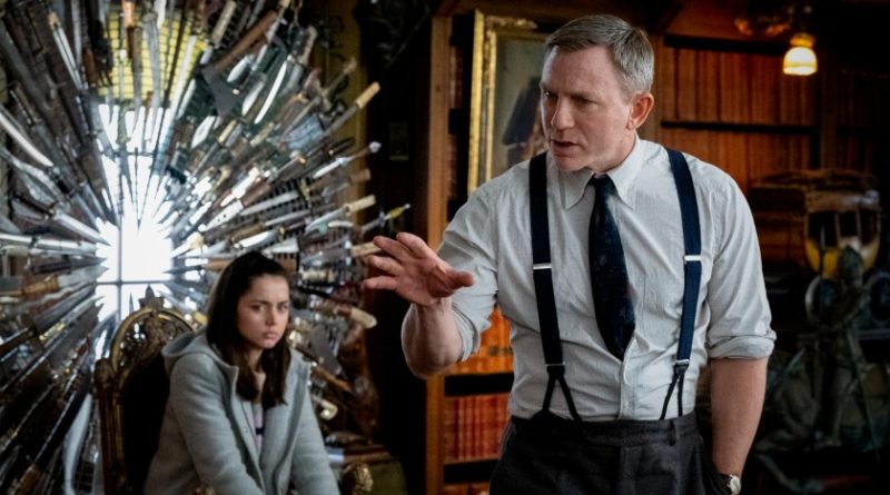 Daniel Craig lays out his solution to Ana de Armas while she sits in a throne made of knives in the movie Knives Out