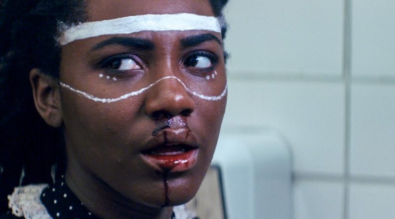 Ireon Roach has her face painted and mouth and nose bloody in the movie Knives and Skin
