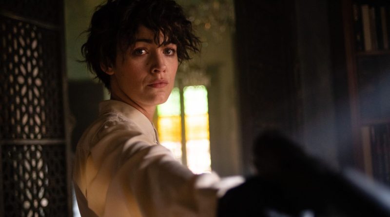 Blake Lively points a gun at someone in the bottom right corner of the camera in the movie The Rhythm Section