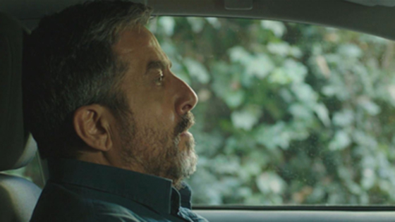 Menashe Noy sits anxiously in his car in the short film Father’s Sonata, from the Boston Israel Film Festival.