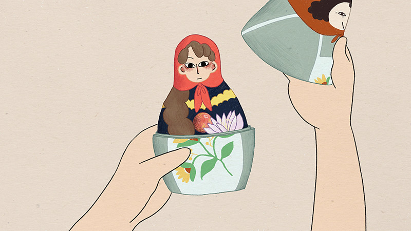 A still from the animated short Moon Blood, where a girl is pulling open a Russian nesting doll with her face on it.